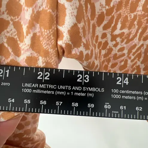 Laila Ali tan & pink animal print long sleeve shirt with tie up front and hood. Size XS