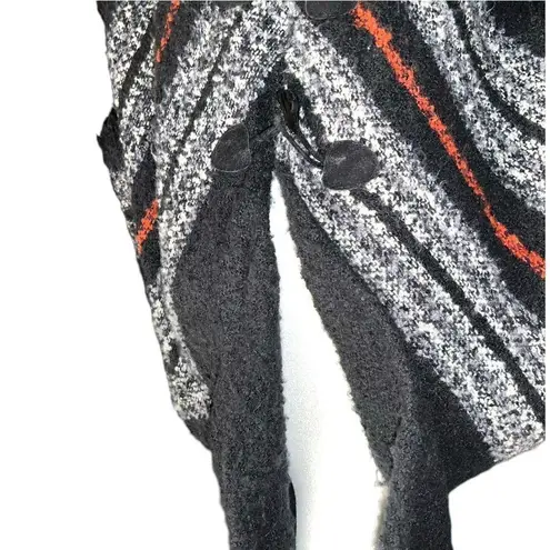 Black poncho with white and ted plaid design. Not a hoodie but a high collar! Size undefined