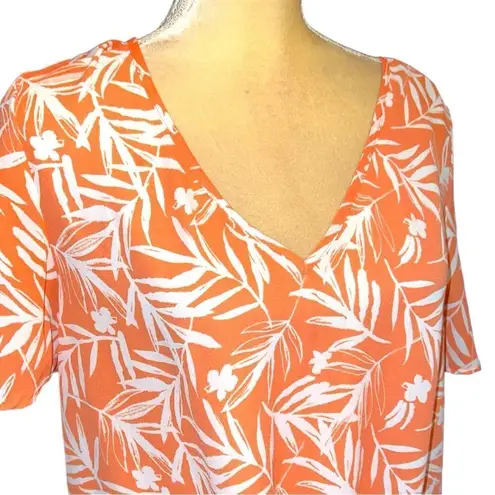 Nine Britton  cute new white tie front top with orange floral design.