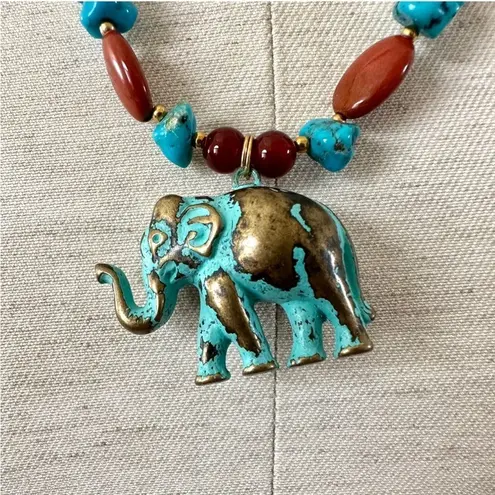 Brass elephant pendant necklace with carnelian, turquoise and red jasper beads