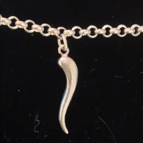 Sterling silver and peridot lucky charm bracelet.