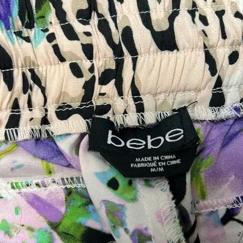 Bebe  Floral Animal print blend joggers with faux leather side pockets. Size M