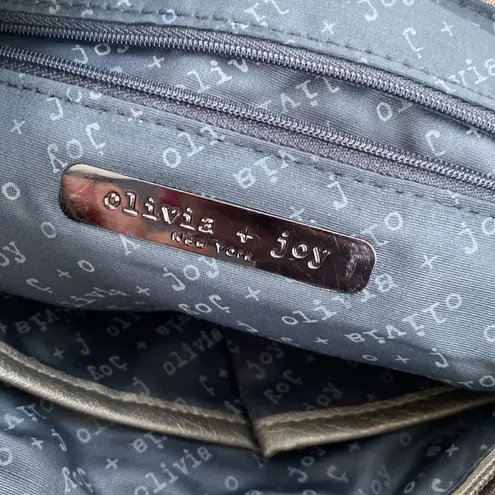 Olivia and Joy pewter hand bag with zipper embellishments.