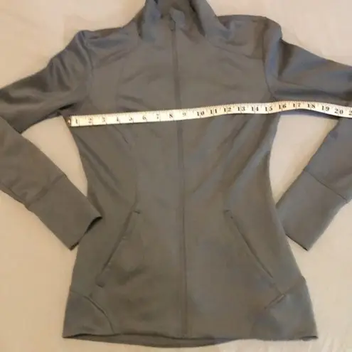 Apana light blue running jacket with thumbholes and two pockets size XS