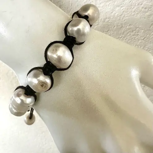 Pearl bracelet on adjustable black silk cord