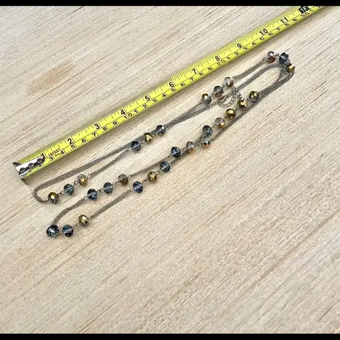 Long silver tone crystal necklace