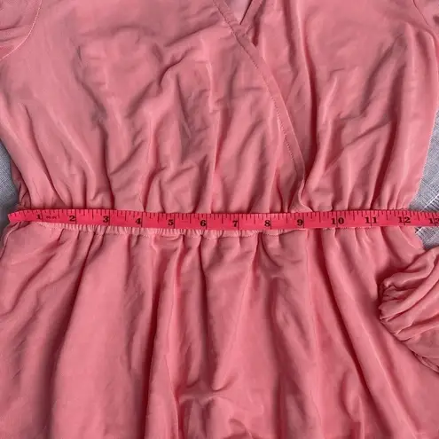 Morgan Taylor two tiered pink dress with sheer long sleeves.