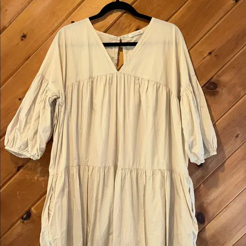 Black crane oversized puff jumpsuit in light clay color