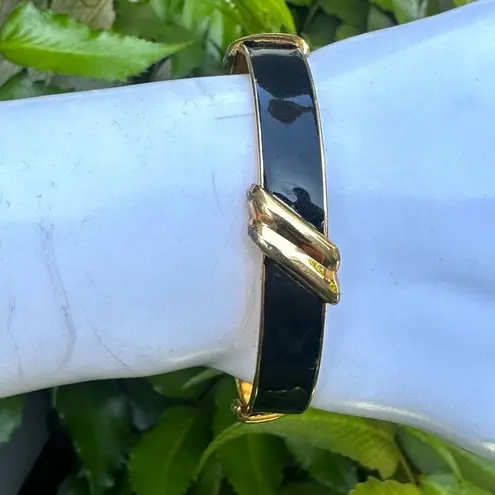 Monet black and gold tone bangle bracelet