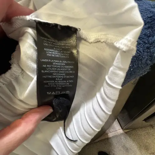 Maeve Amary Black Open Knit Sweater with white pleated hem