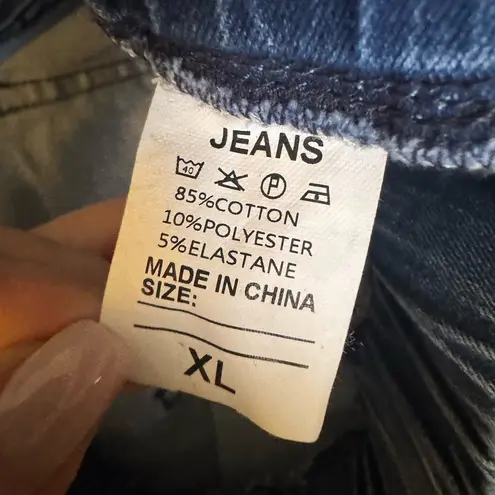 Women’s unbranded flare jeans, stretch fabric, raw hem, size XL, medium wash Blue