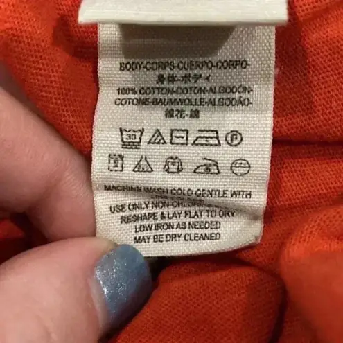 We The Free Free people  anytime peplum tank top in an orange color