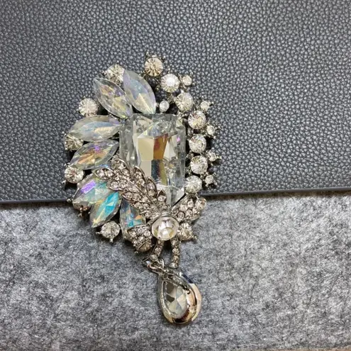 La Prarie clutch with brooch pin