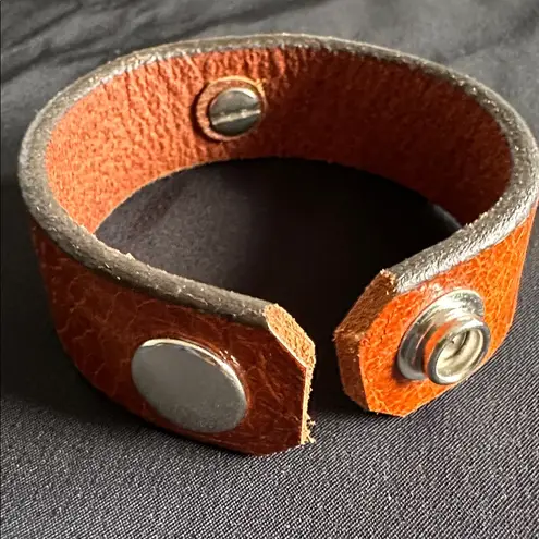 Leather EUC snap bracelet with silvertone medallion and CZ center stone Brown