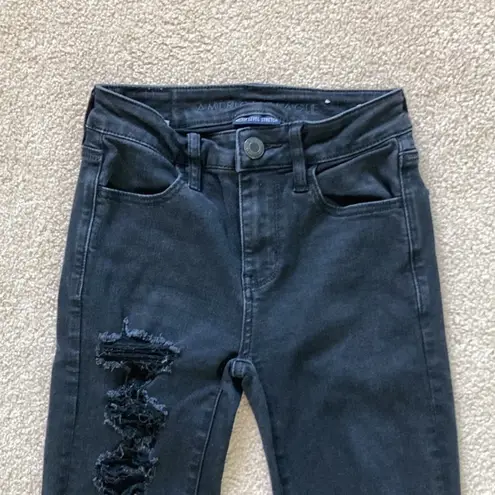 American Eagle  high rise distressed black jegging jeans in size 00