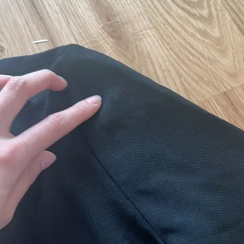 Area black asymmetrical jumpsuit with crystal embellishment