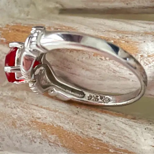 Sterling Silver Claddagh Ring with Garnet Heart Stone