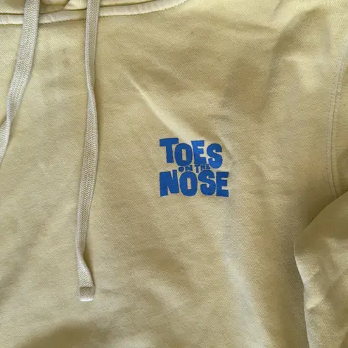 Toes on the nose Yellow Hoodie with Front Pocket and blue lettering