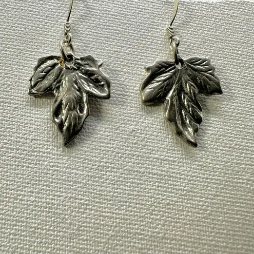 Silver tone maple leaf earrings