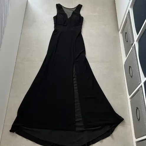 Women size small long black dress with small train bust and waist mesh detail