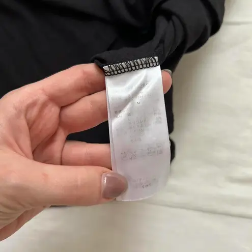 Axes Femme Black and grey lace sleeves blouse with ruffle sleeves tassel detail Size M