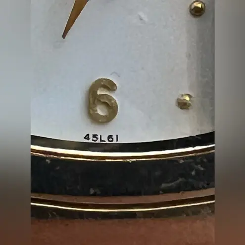 Caravelle by Bulova Ladies Watch Crystals White Dial Gold Tone Stretch Bracelet