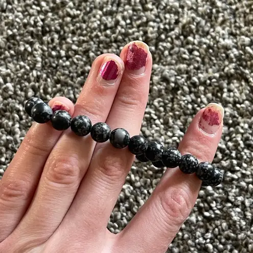 Black with white penguin charm beaded bracelet