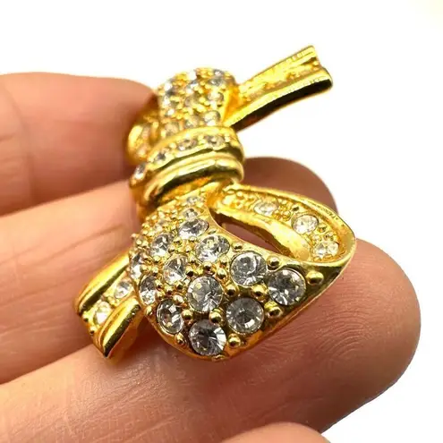 Roman gold tone rhinestone bow brooch