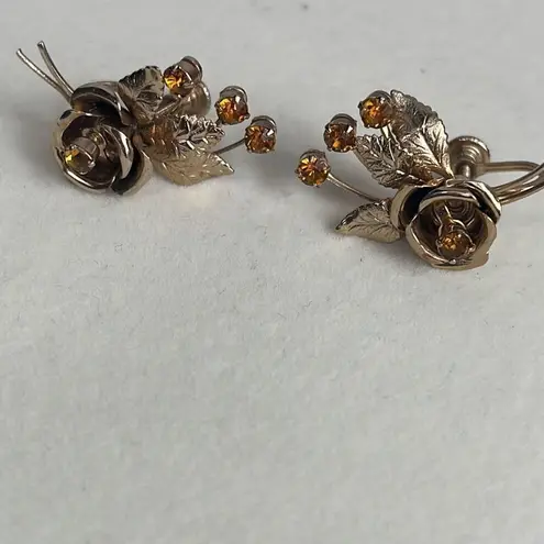 Vintage flower sprays climber earrings. Gold plated amber glass.