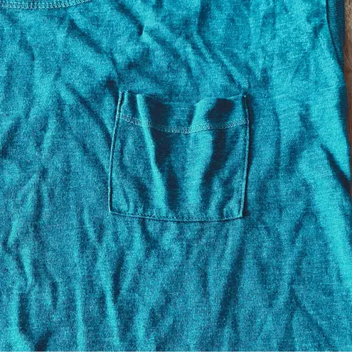 Patagonia  t-shirt, size XS. This woman’s tee is blue/green.