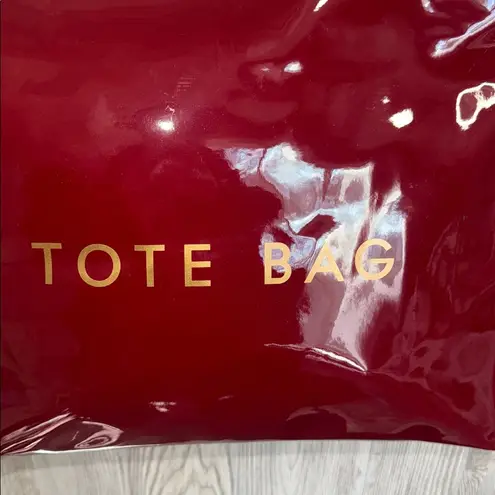 Glossy Red Tote Bag with Gold Lettering the perfect traveling bag