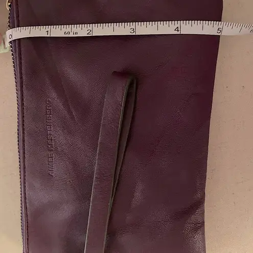 Aimee Kestenberg leather wristlet with built in phone charger battery bank