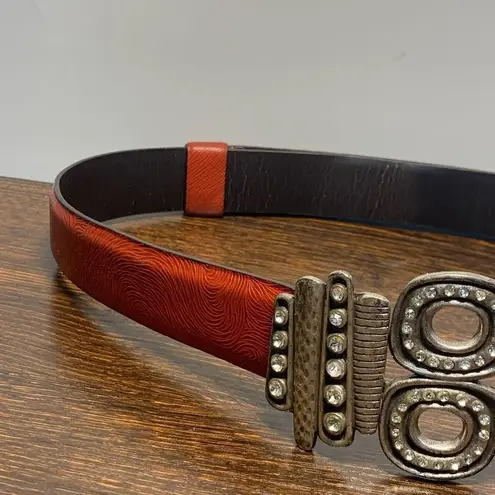 Chicos, leather silver jeweled slide fit belt size small/medium Orange