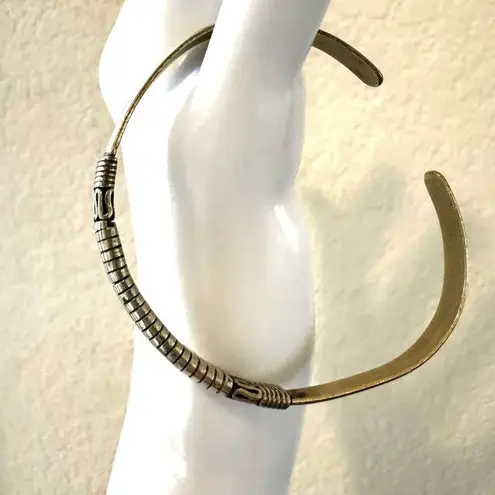 Gold tone etched open cuff bracelet