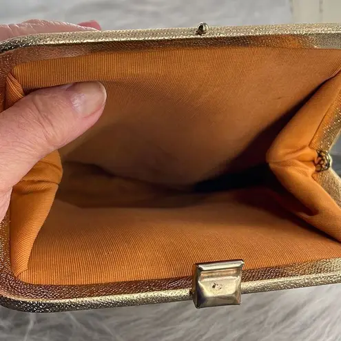 Vintage gold shimmering faux leather glam handbag with tassel. Gold