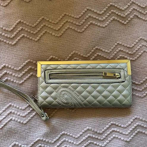 Women’s wristlet with gold accents and wrist strap Tan