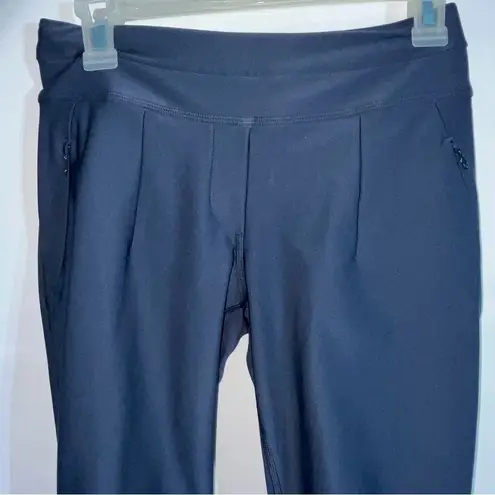 Lululemon  athleta women’s size 4 pants with back calf zippers, zipper pockets.