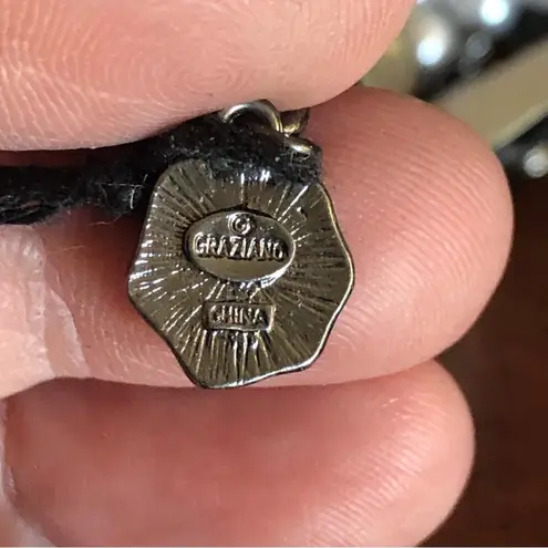 R.J. Graziano triple strand graduated white pearl stone bow necklace