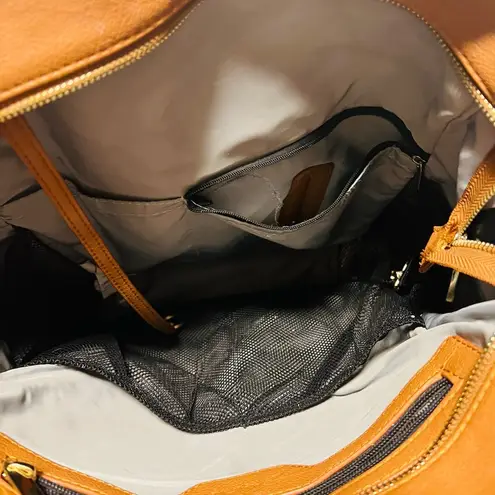 Brown patent leather diaper bag with multiple pockets and key holders