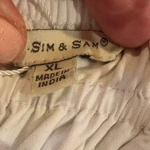 Sim & Sam crop top with tie straps, a smocked bodice, and a ruffled hem NWT