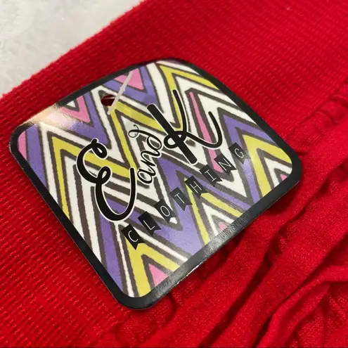 E & K Clothing. Woman’s Skirt. One size, stretchy fabric. Fit Small to Med. Red Size undefined