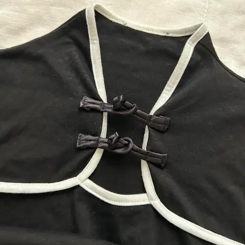 Black and white long sleeve crop top with chinoiserie inspired details