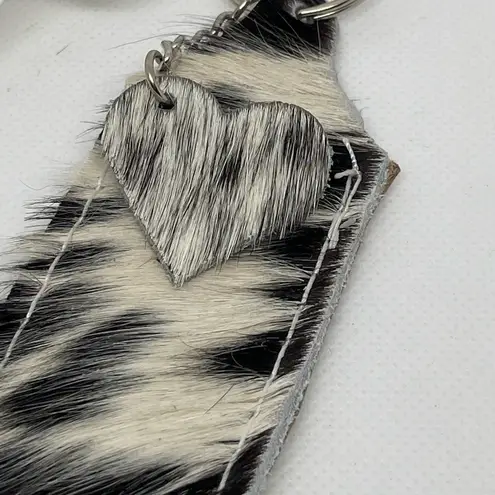 Cowhide chapstick holder. Attach to purse or backpack to keep it handy!