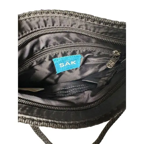 The Sak Black Crochet Knit Shoulder Bag with Silver Charm Casual Everyday Handbag