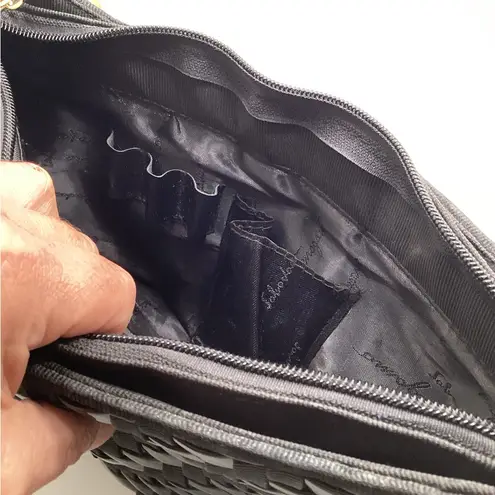 Nylon and vinyl weave purse. Great size with multiple separations. Black