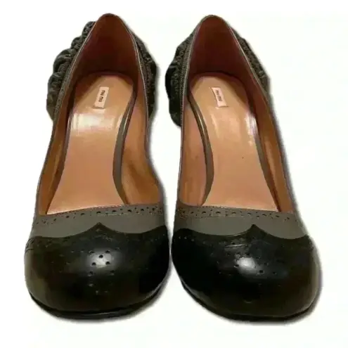 Miu Miu Italian, gray/black brogue leather pumps with ruffle heels; size 40.5