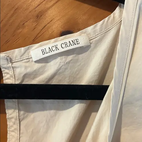 Black crane oversized puff jumpsuit in light clay color