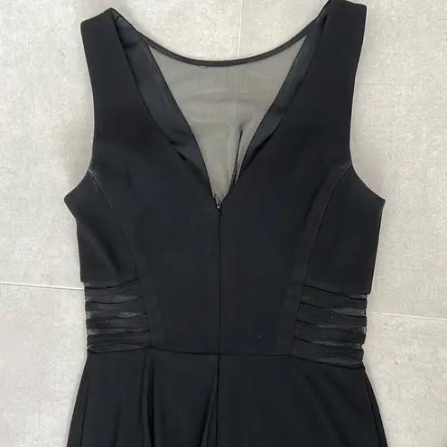 Women size small long black dress with small train bust and waist mesh detail