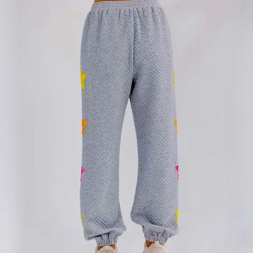 Main Strip WOMEN'S ELASTIC WAIST FRONT POCKET SEQUINS STARS DETAILED SWEATPANTS Medium