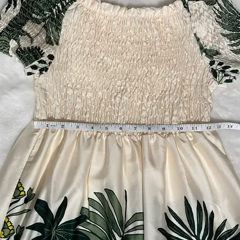 Coolples Made in Italy maxi dress featuring a smocked bodice, short sleeves. Size L